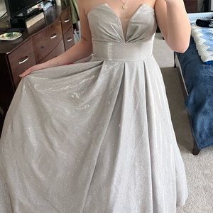 It is a strapless, glittery prom dress.